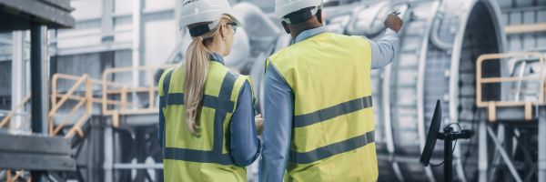 two,diverse,professional,heavy,industry,engineers,wearing,safety,uniform,and